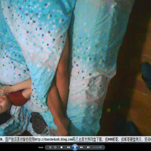 0012-Hidden camera in a Chinese hotel captures a girl masturbating while her boyfriend sleeps.