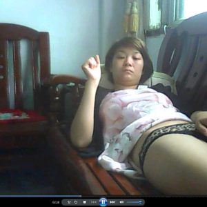 0100-RATCAM Leaked footage of a woman in China, captured via a hacked camera, shows her masturbating on a sofa.